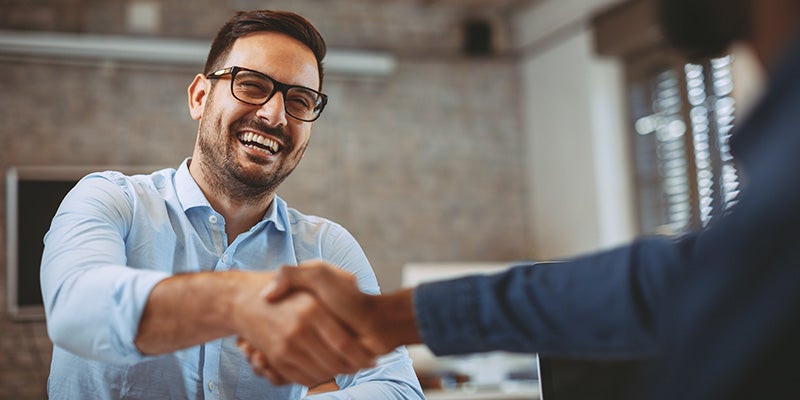 Atchinson Ford in Belleville MI technician shaking hands with a customer